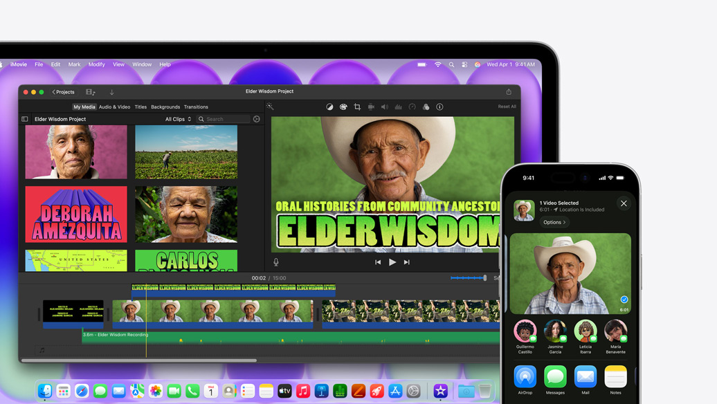 MacBook Neo i farven sølv viser et iMovie-vindue med titlen Elder Wisdom Project ved siden af en iPhone, der viser video med en af personerne fra iMovie-vinduet, under videoen er der en række delingsmuligheder, blandt andet AirDrop