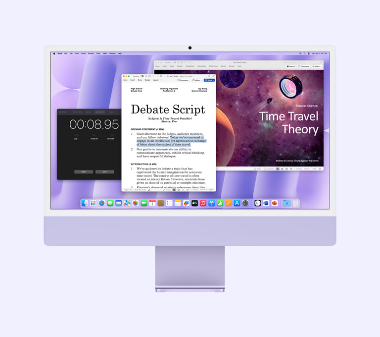 Violets iMac: ekrānā redzamas Microsoft Word, Microsoft PowerPoint un Clock aplikācijas